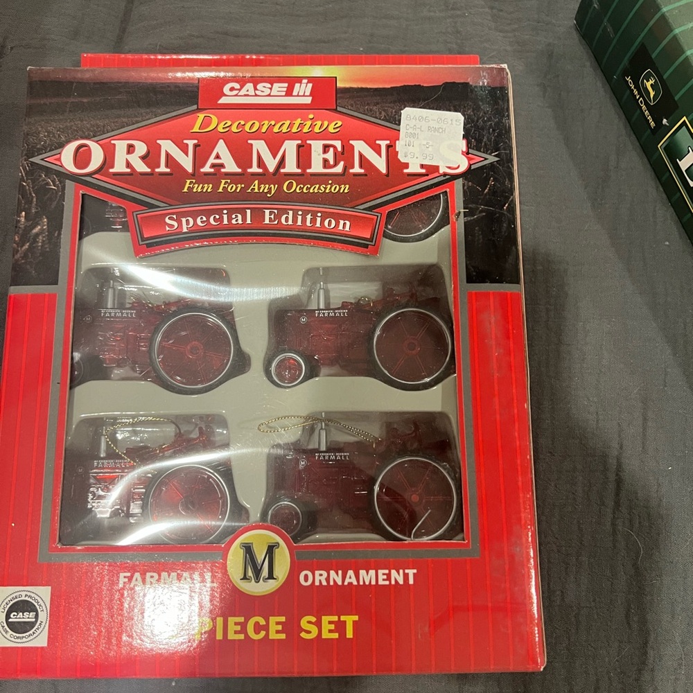 Case red tractor ornaments. NIB